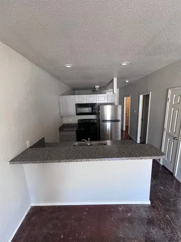a view of kitchen island with furniture