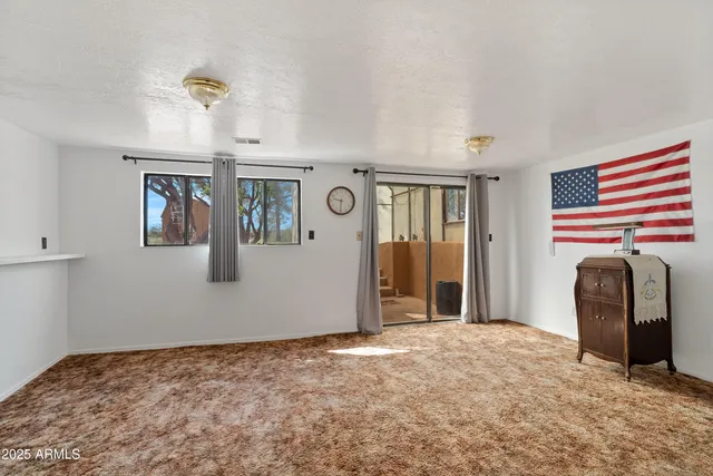 a bedroom with a bed and cabinets