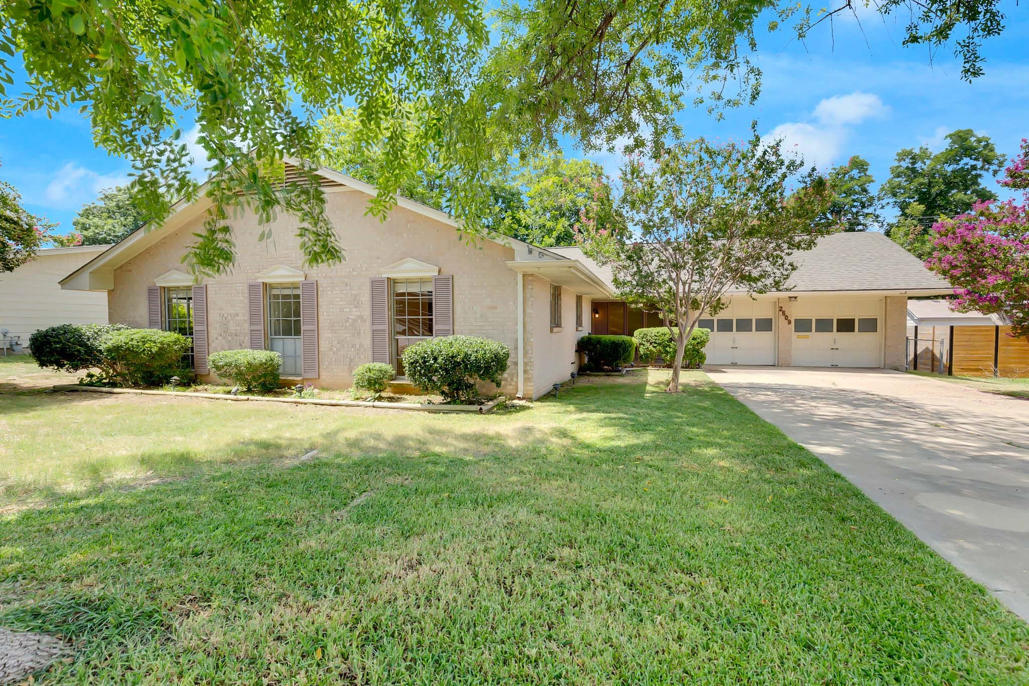 2609 Richcreek Road Austin, TX 78757 - Photo 1 of 28 a front view of house with yard and green space