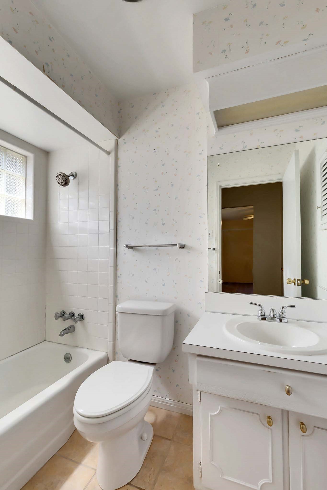 2609 Richcreek Road Austin, TX 78757 - Photo 16 of 28 a bathroom with a sink a toilet and shower