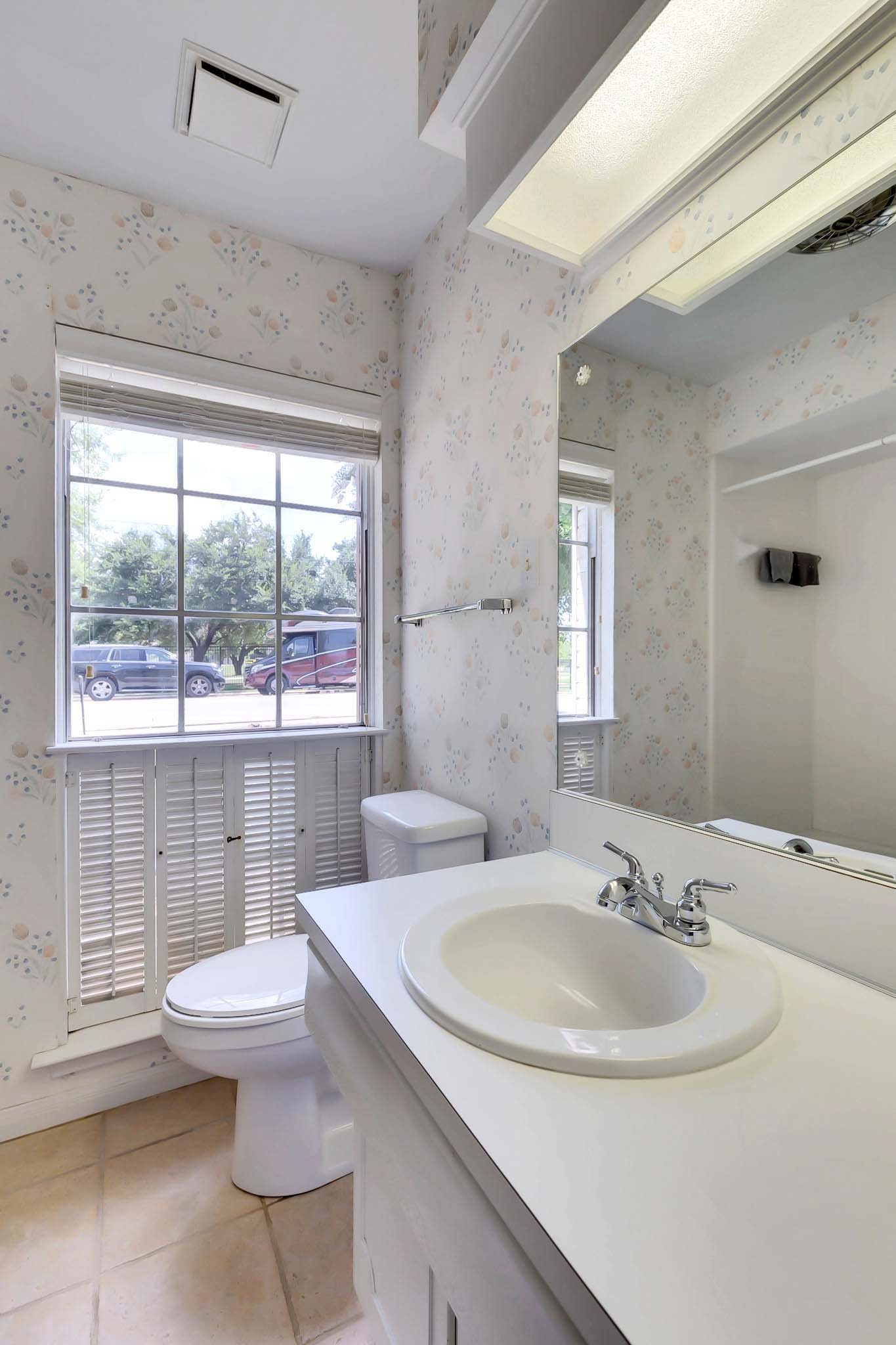 2609 Richcreek Road Austin, TX 78757 - Photo 17 of 28 a bathroom with a sink toilet and shower