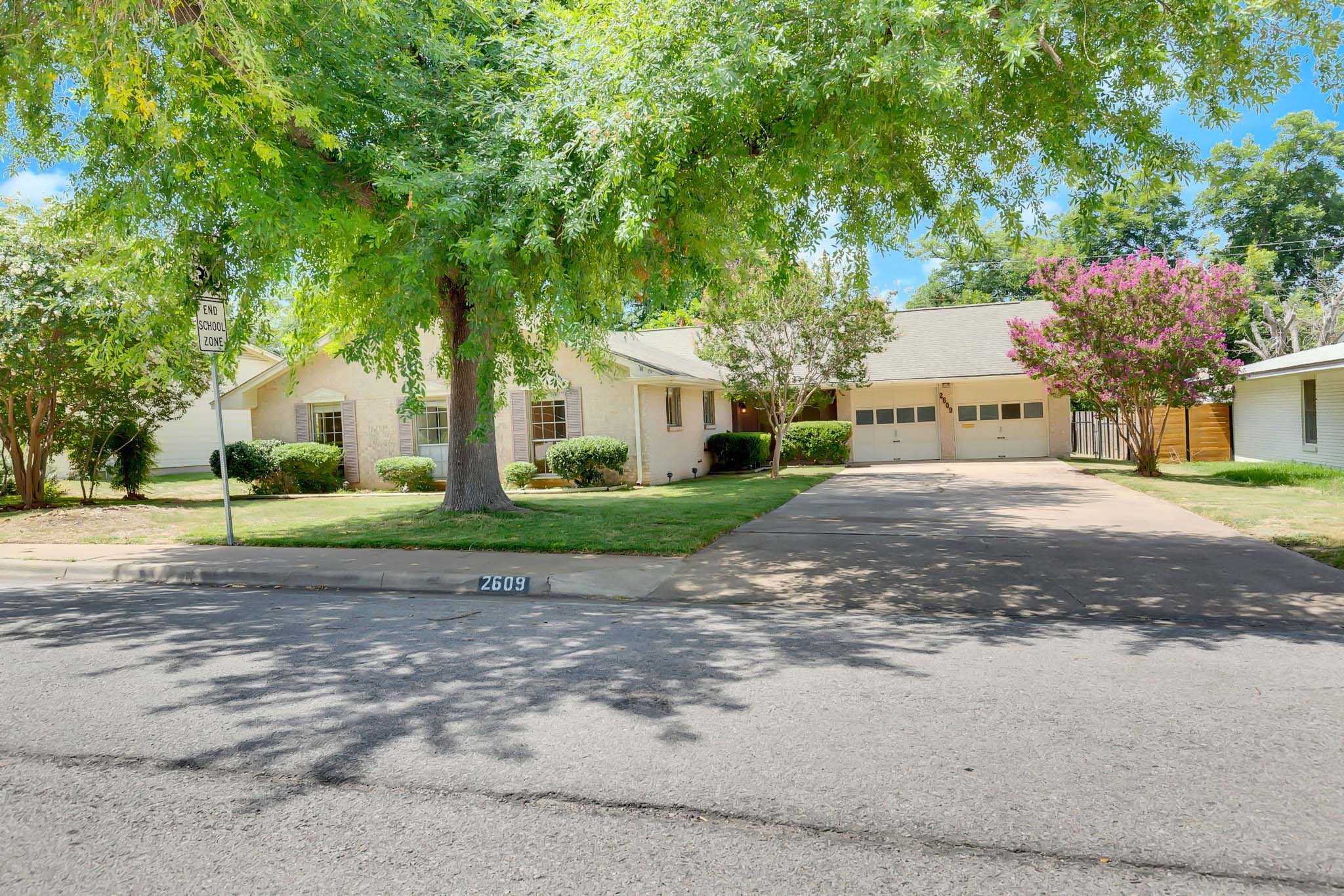 2609 Richcreek Road Austin, TX 78757 - Photo 2 of 28 a view of a house with a yard and large trees