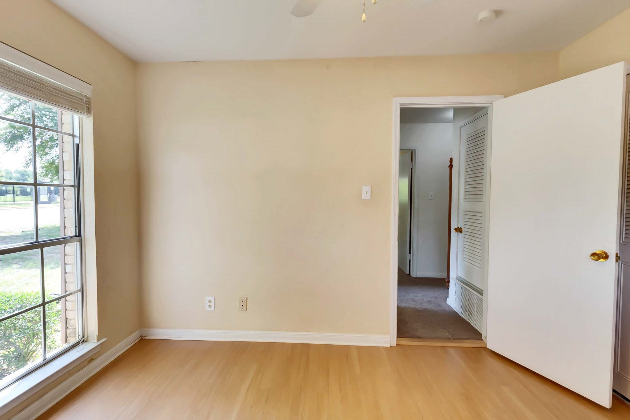 2609 Richcreek Road Austin, TX 78757 - Photo 23 of 28 a view of an empty room with wooden floor and a window