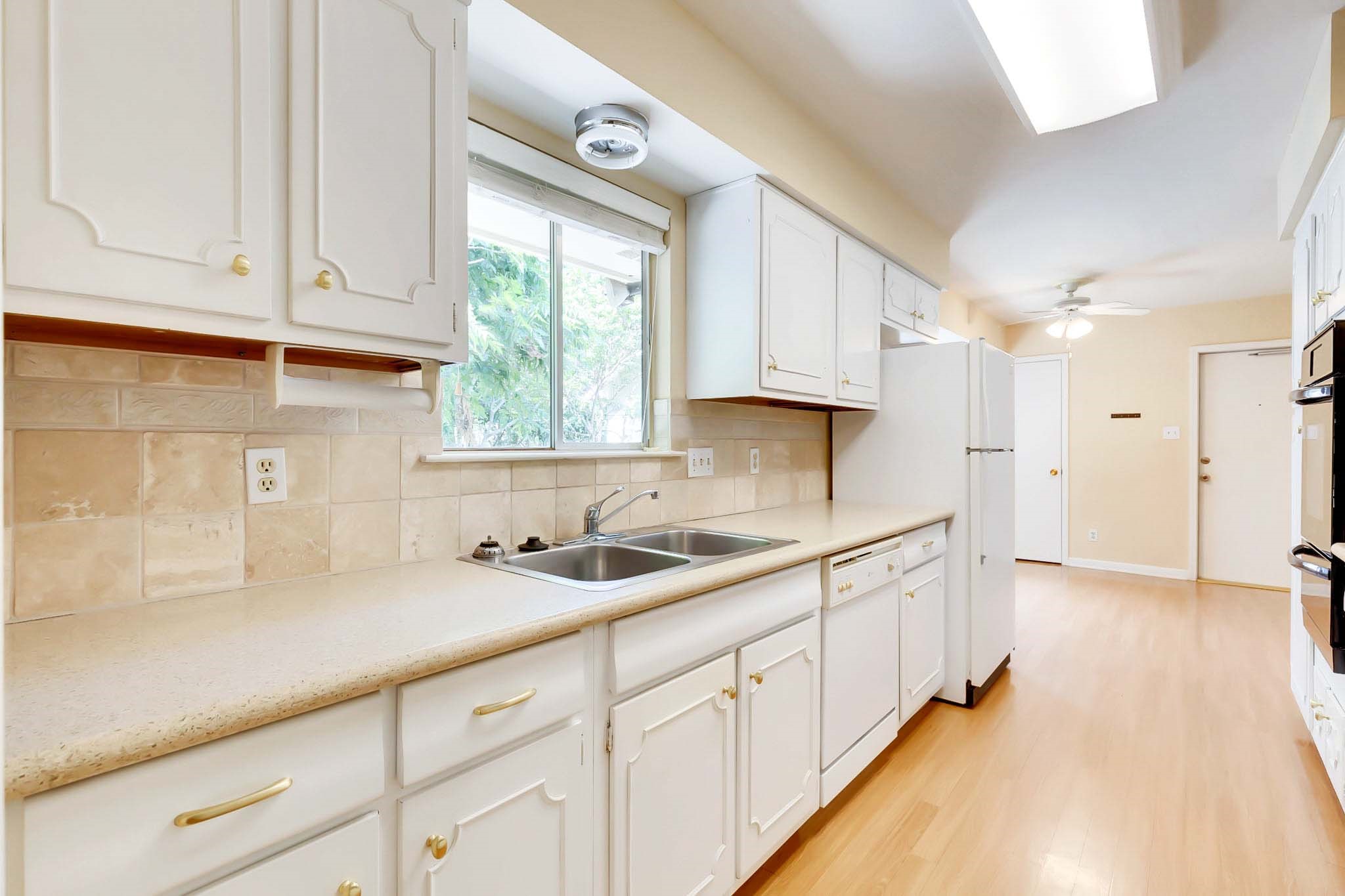2609 Richcreek Road Austin, TX 78757 - Photo 4 of 28 a kitchen with sink and cabinets