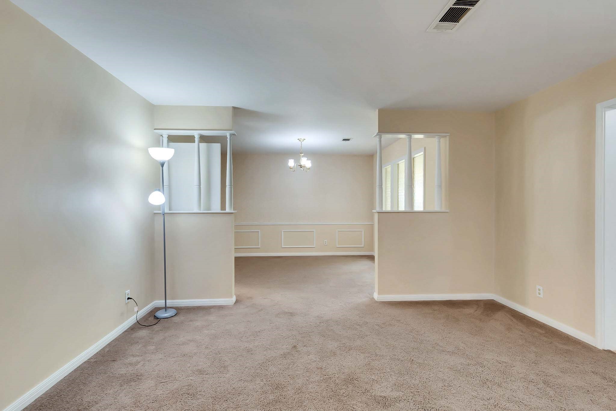 2609 Richcreek Road Austin, TX 78757 - Photo 9 of 28 wooden floor in an empty room with a window