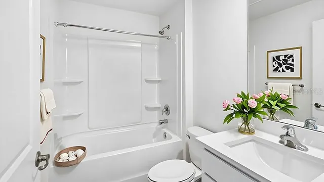 a bathroom with a sink a toilet and a bathtub