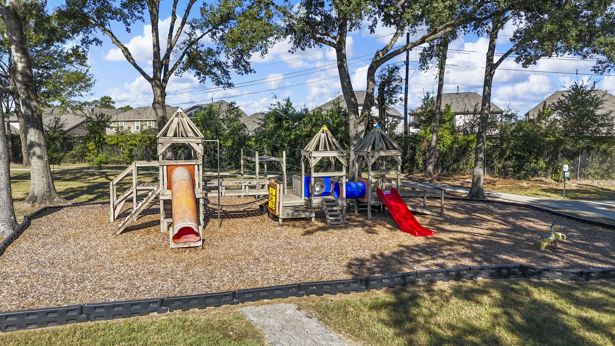23826 Lestergate Drive Spring, TX 77373 - Photo 44 of 45 Another playground area adds even more room to enjoy the neighborhood outdoors, with multiple play structures set beneath mature trees and surrounded by open green space. It’s an easy place for an afternoon outside and another piece of the laid-back community lifestyle Birnam Wood offers.