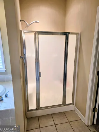 a view of front door with wooden floor