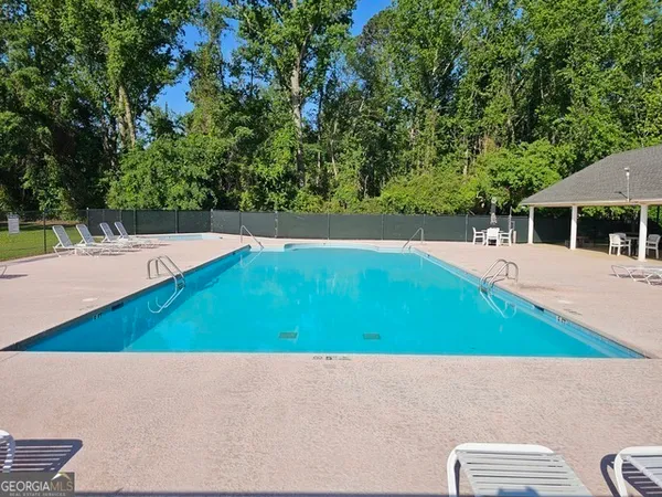 a view of a swimming pool with an outdoor space