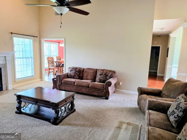 a living room with furniture and a window