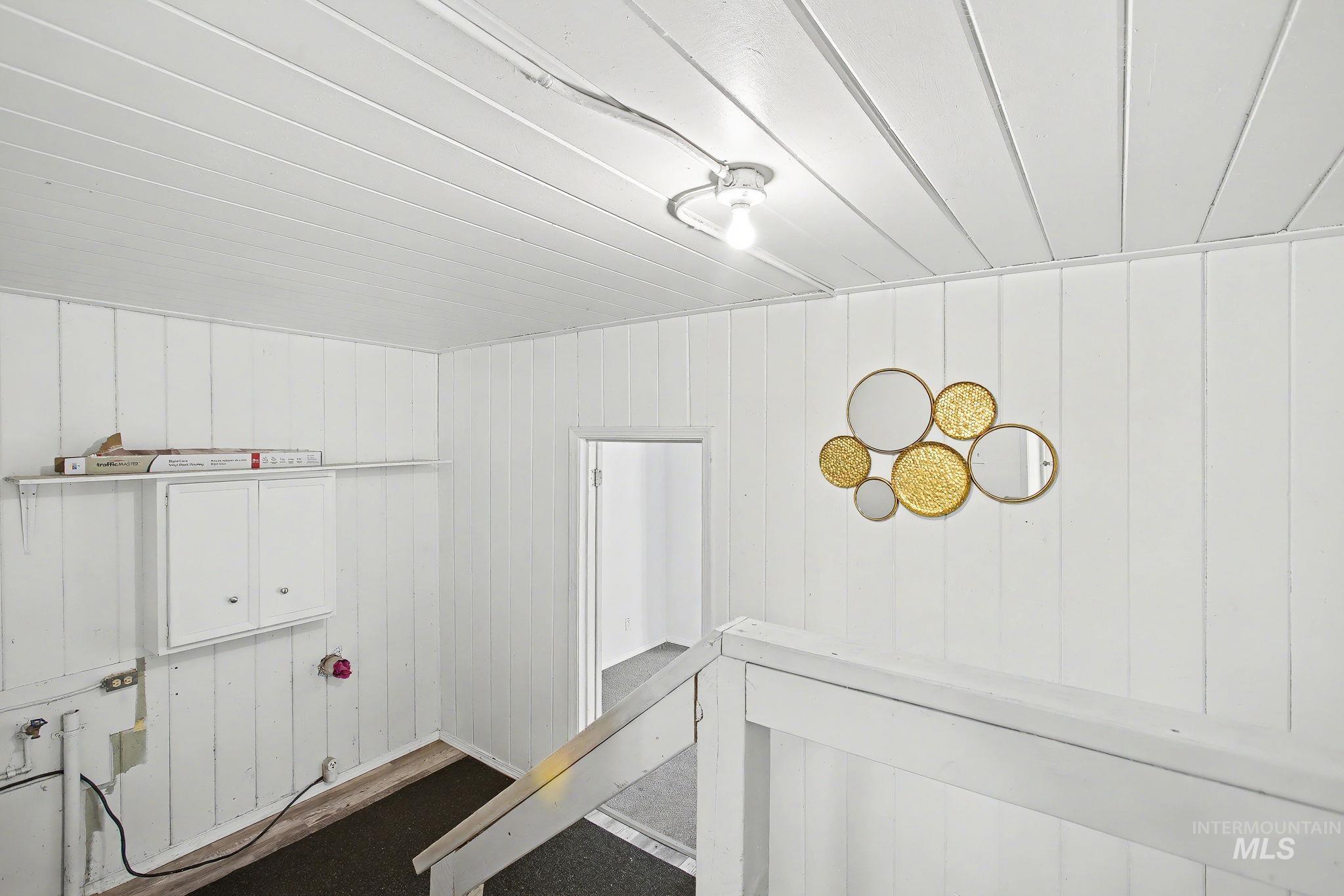 150 Elm Street Orofino, ID 83544 - Photo 18 of 36 Vertical wood-panel walls and a panel ceiling provide a consistent aesthetic
