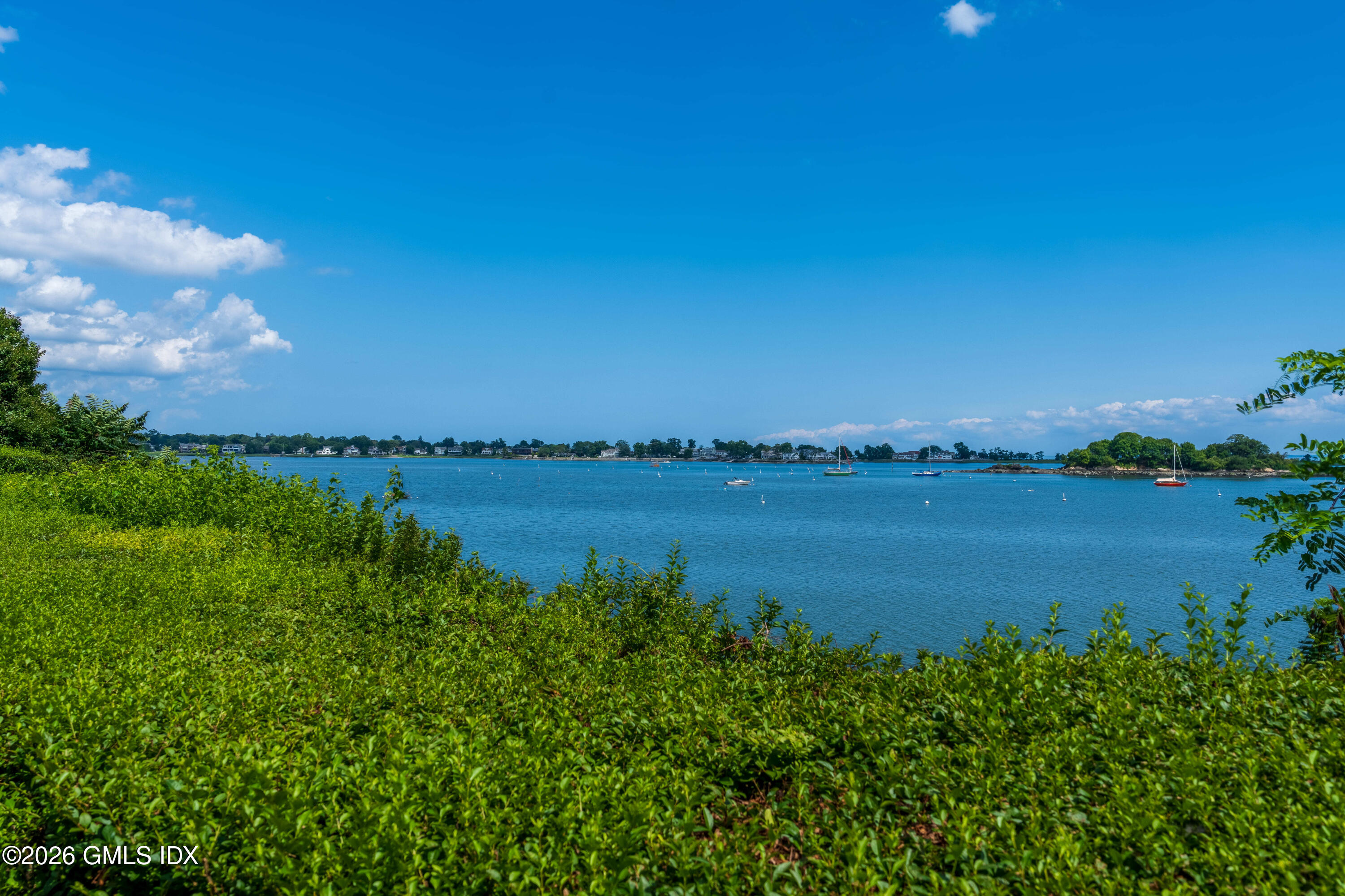 108 Cedar Cliff Road Riverside, CT 06878 - Photo 38 of 49 a view of a lake with a city view