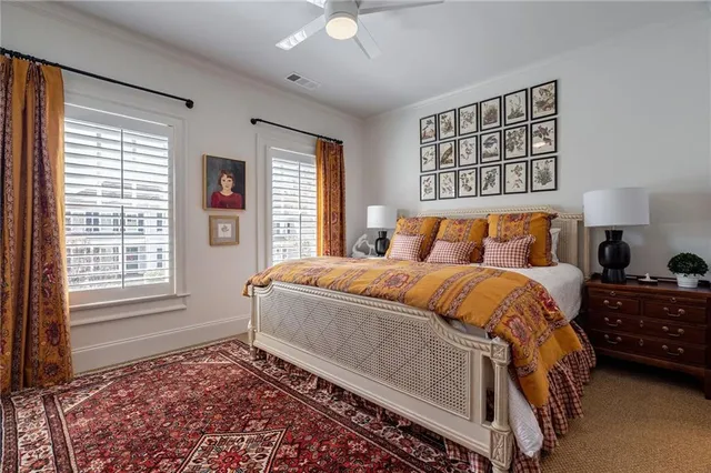 a bedroom with a large bed and a window