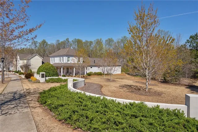 a view of a street with a building in the background