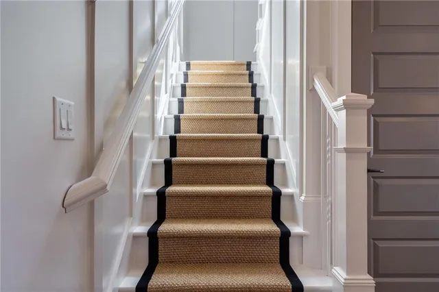 a view of staircase with white walls