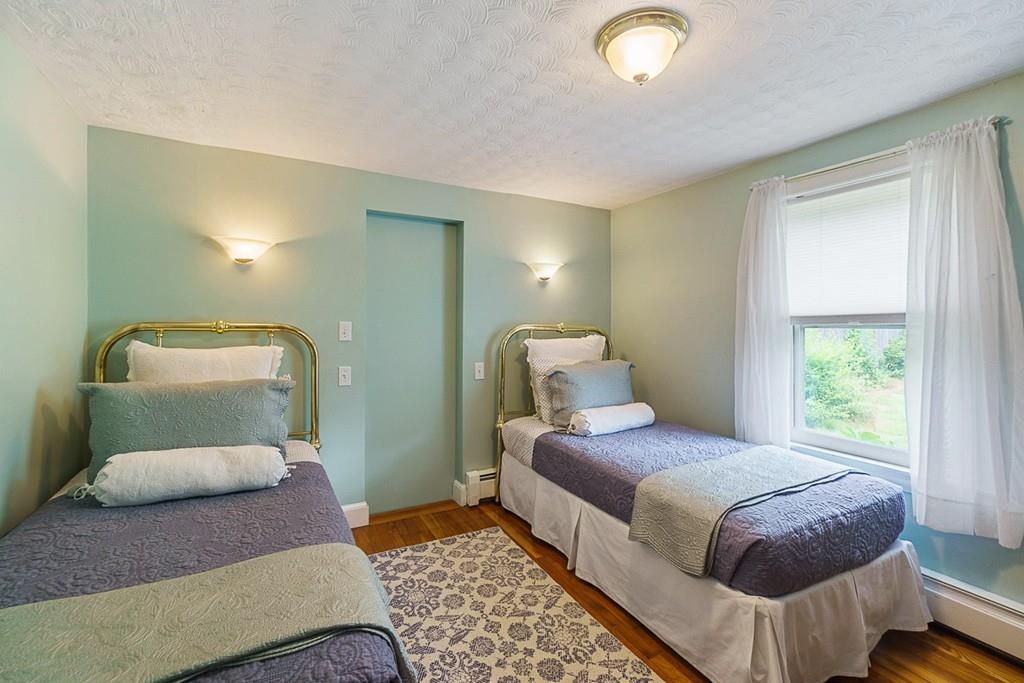 10 Charme Road Billerica, MA 01821 - Photo 12 of 42 a bedroom with a bed and a mirror