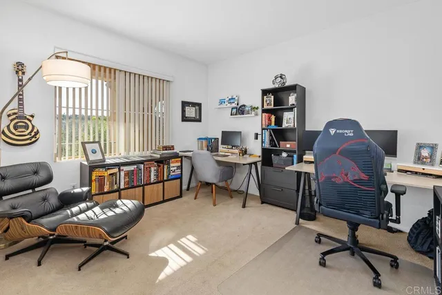 a workspace with furniture and a window