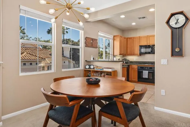 a dining room with furniture and window