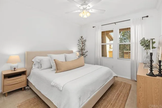 a bedroom with bed and a window