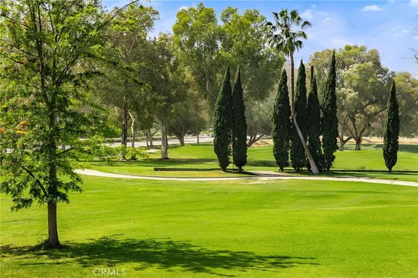a view of a lake with a house in the background