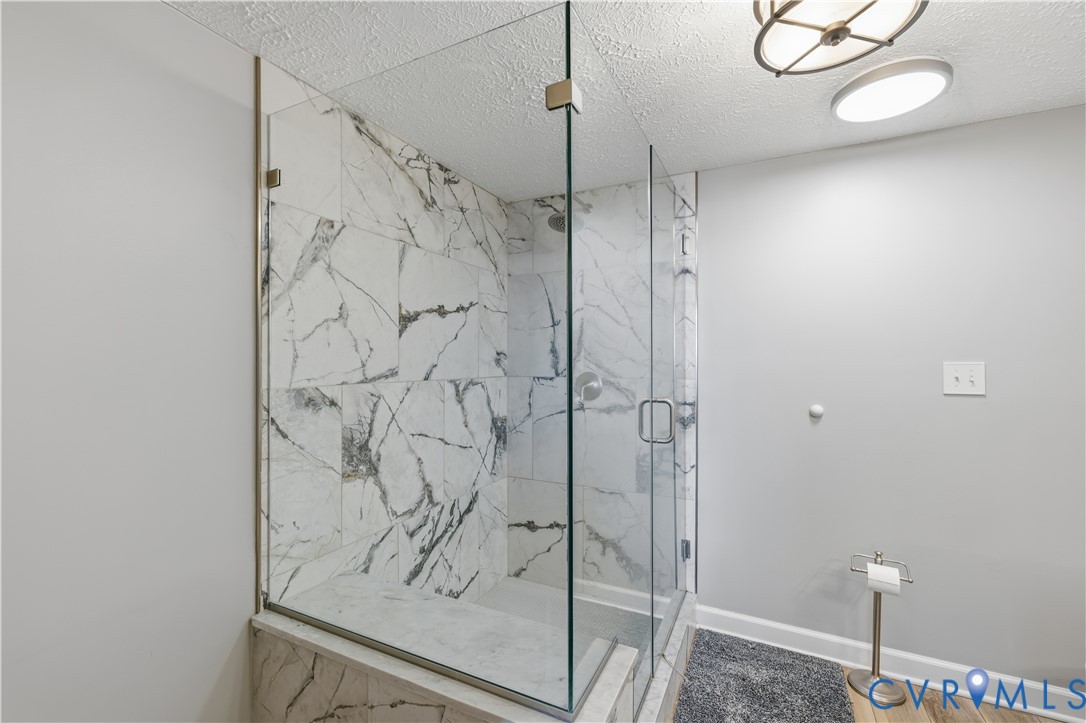 100 Taylor Street, Unit 302 Colonial Beach, VA 22443 - Photo 15 of 30 Bathroom featuring a marble finish shower and a te