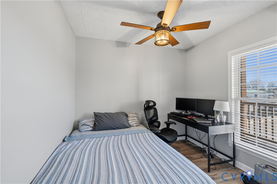 100 Taylor Street, Unit 302 Colonial Beach, VA 22443 - Photo 18 of 30 Bedroom with a textured ceiling, a ceiling fan, da