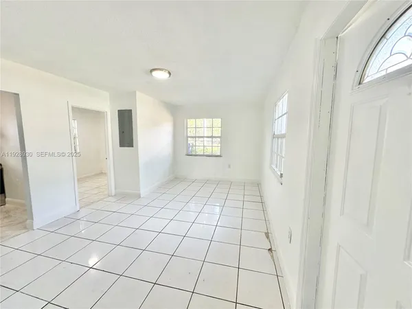 a view of an empty room and window