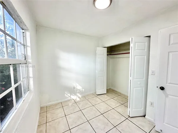 a view of an empty room and window