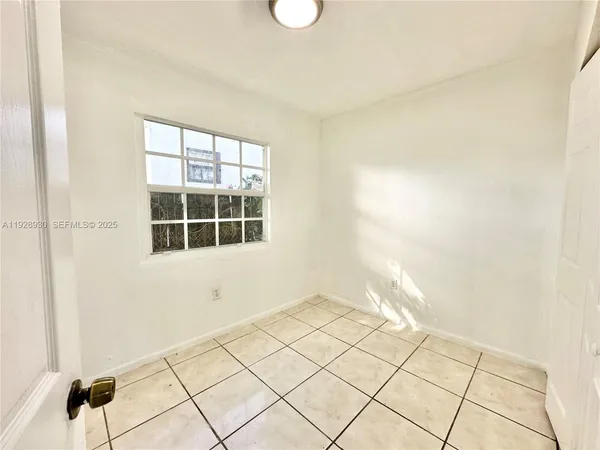 a view of an empty room and window