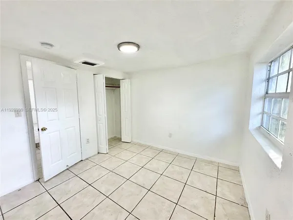 a view of an empty room and window