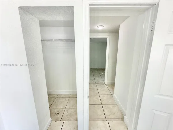 a bathroom with a glass door shower