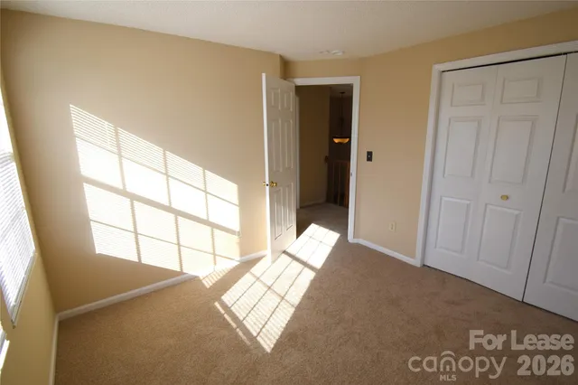 a view of empty room with windows