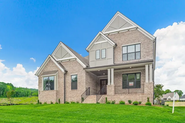 a view of hallway with wooden floor