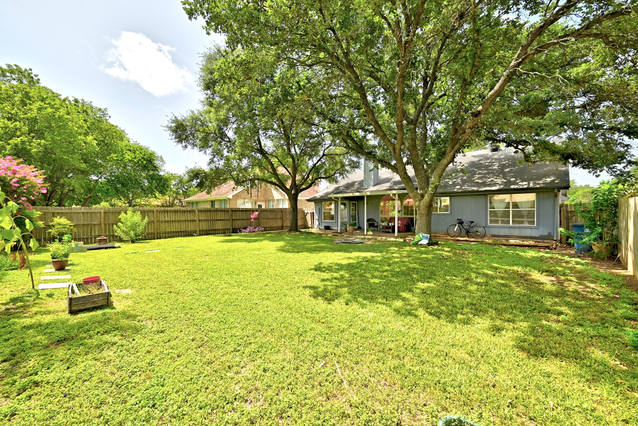 6412 Colton-Bluff Springs Road Austin, TX 78744 - Photo 23 of 27 Generous backyard space, complete with mature trees for shade and a private fence.