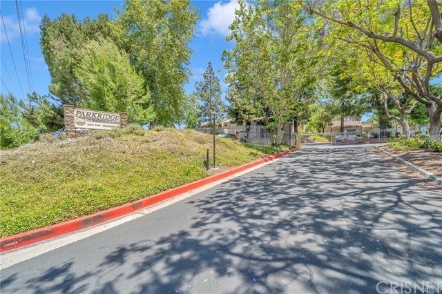 3020 Associated Road, Unit 114 Fullerton, CA 92835 - Photo 1 of 1 a view of a yard with large trees