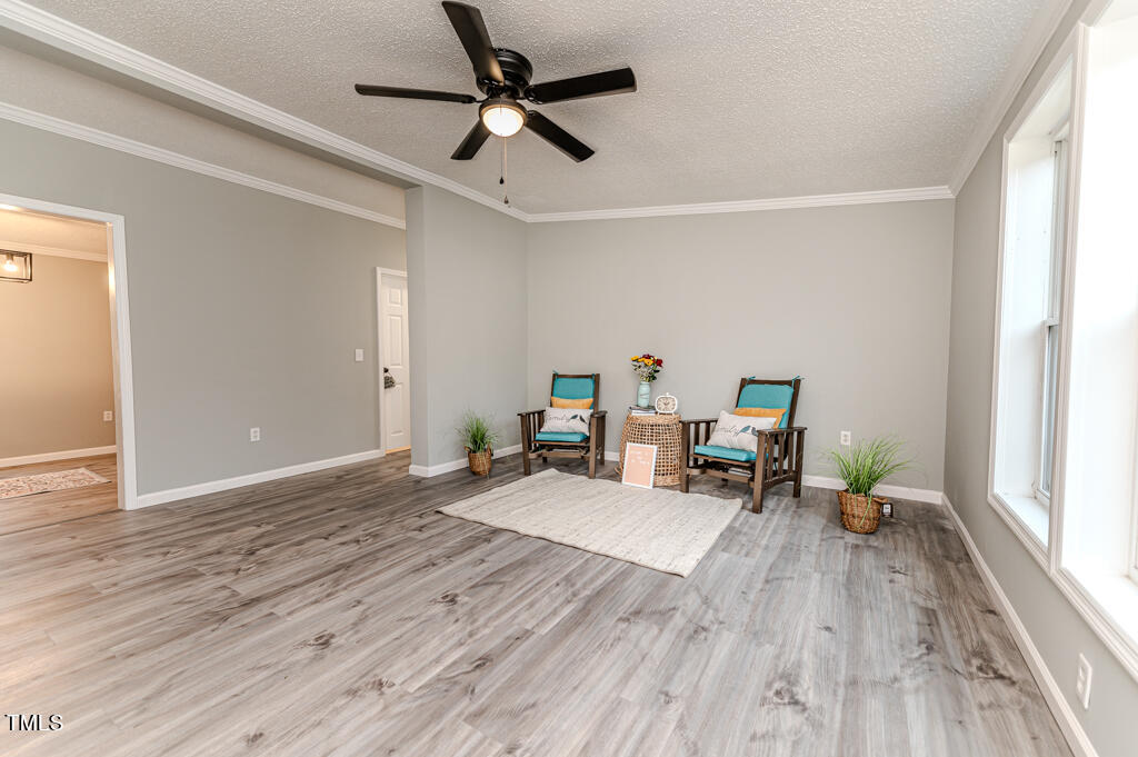 2245 Docs Road Lillington, NC 27546 - Photo 11 of 54 a living room with furniture and a large window