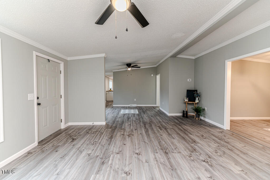 2245 Docs Road Lillington, NC 27546 - Photo 13 of 54 wooden floor in an empty room with a window