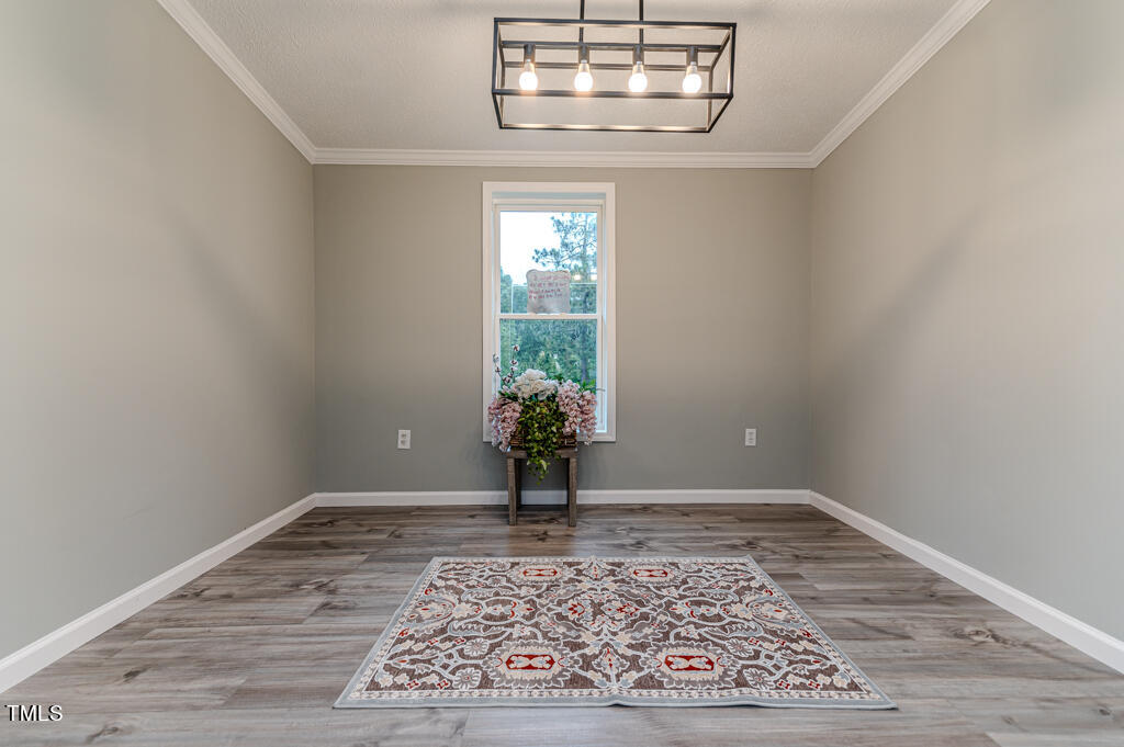 2245 Docs Road Lillington, NC 27546 - Photo 15 of 54 wooden floor in a hall with a window