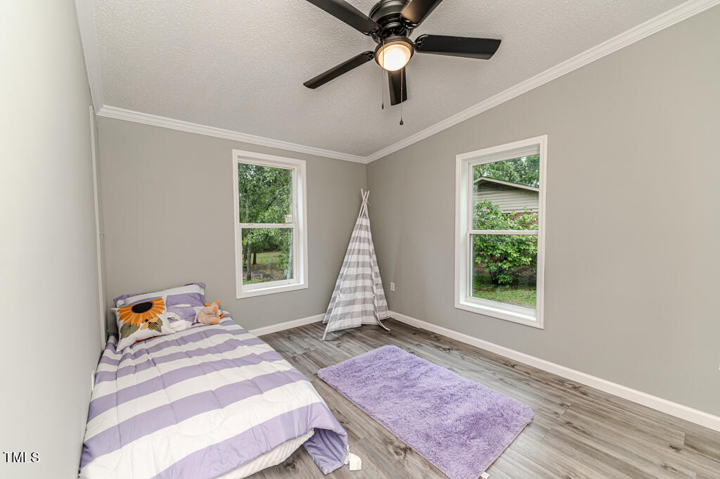2245 Docs Road Lillington, NC 27546 - Photo 18 of 54 a bedroom with a bed and a window