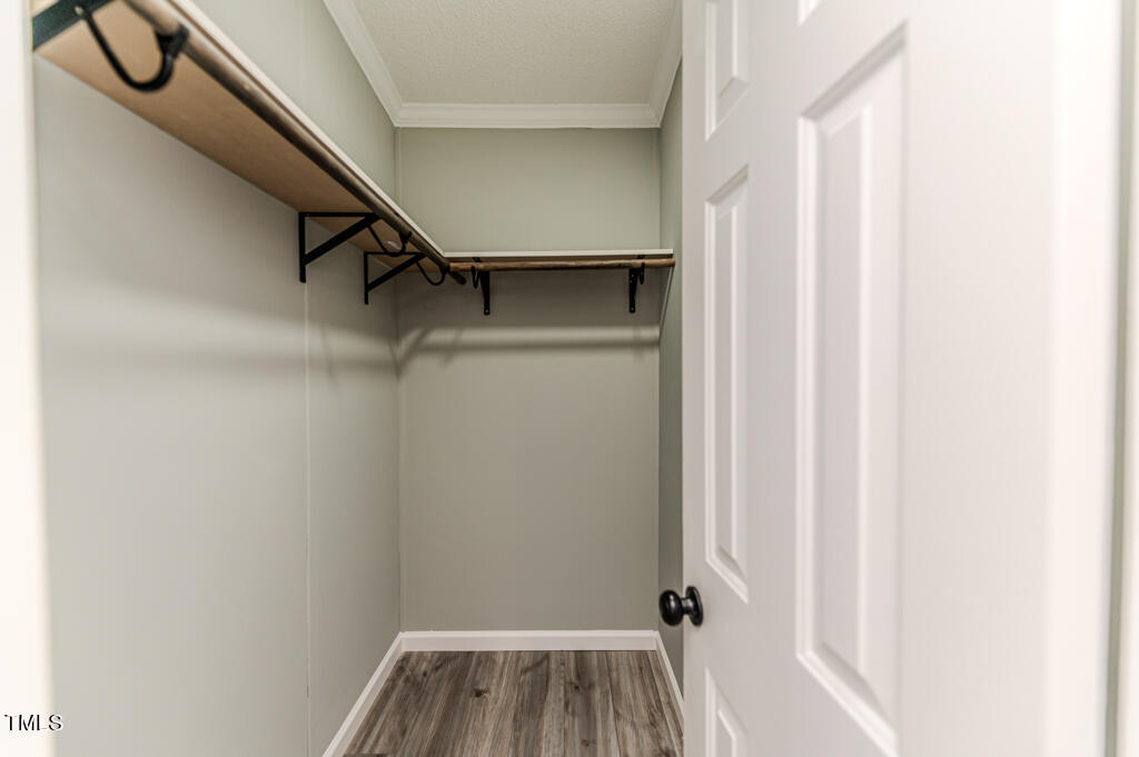2245 Docs Road Lillington, NC 27546 - Photo 20 of 54 a view of walk in closet with empty racks