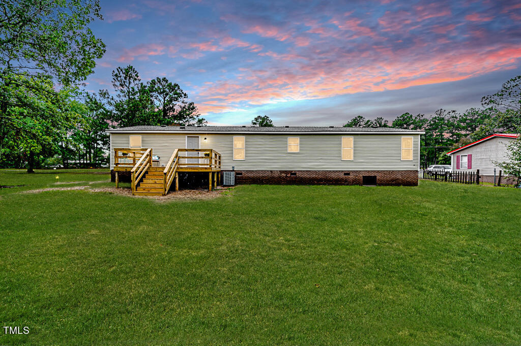 2245 Docs Road Lillington, NC 27546 - Photo 2 of 54 front view of a house with a yard
