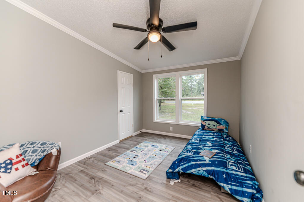2245 Docs Road Lillington, NC 27546 - Photo 21 of 54 a bedroom with bed and a window