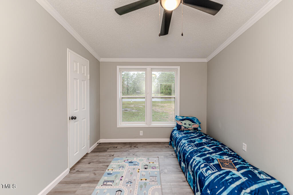 2245 Docs Road Lillington, NC 27546 - Photo 22 of 54 a bedroom with a bed and a window
