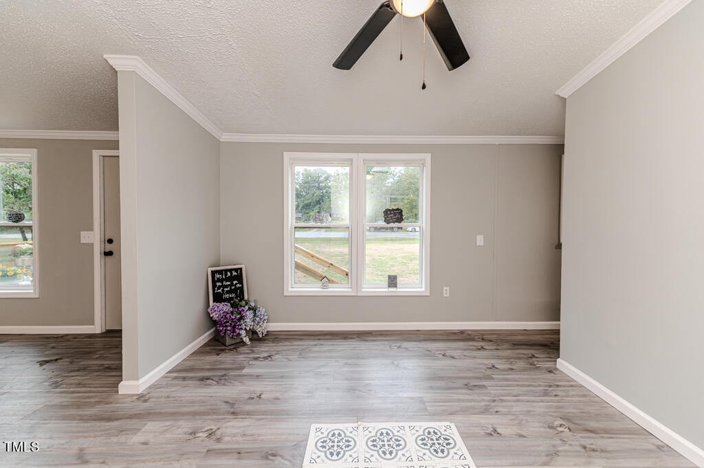 2245 Docs Road Lillington, NC 27546 - Photo 23 of 54 an empty room with wooden floor and windows