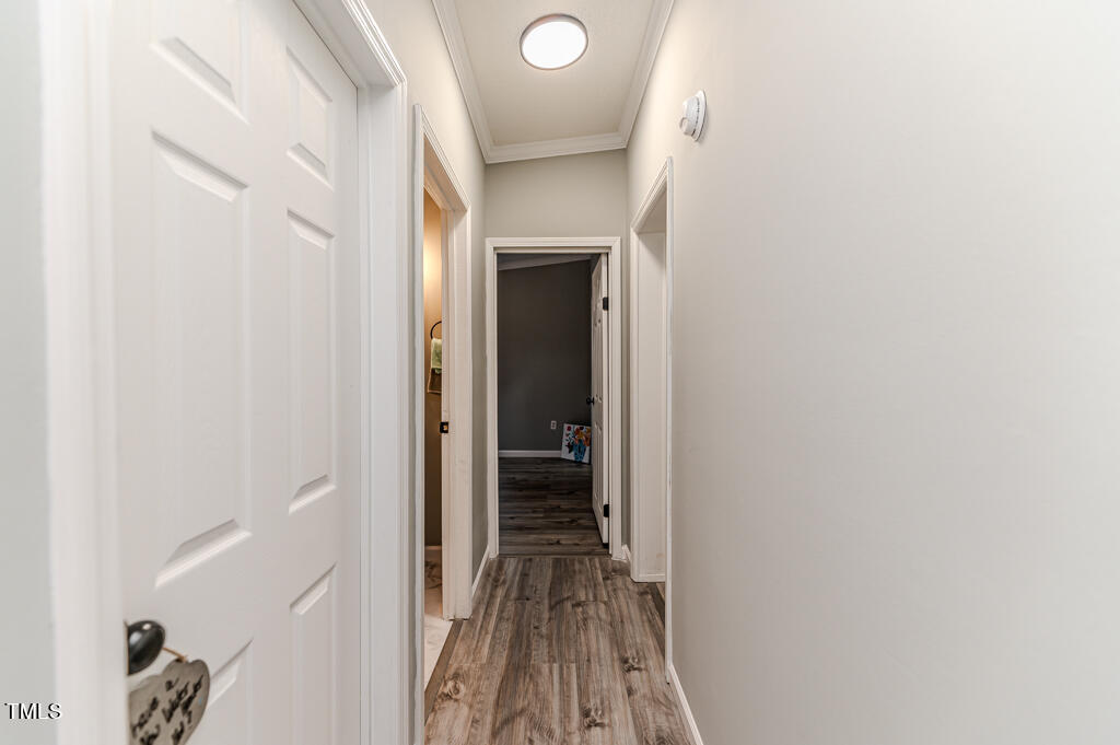 2245 Docs Road Lillington, NC 27546 - Photo 54 of 54 a view of a hallway with wooden floor and closet