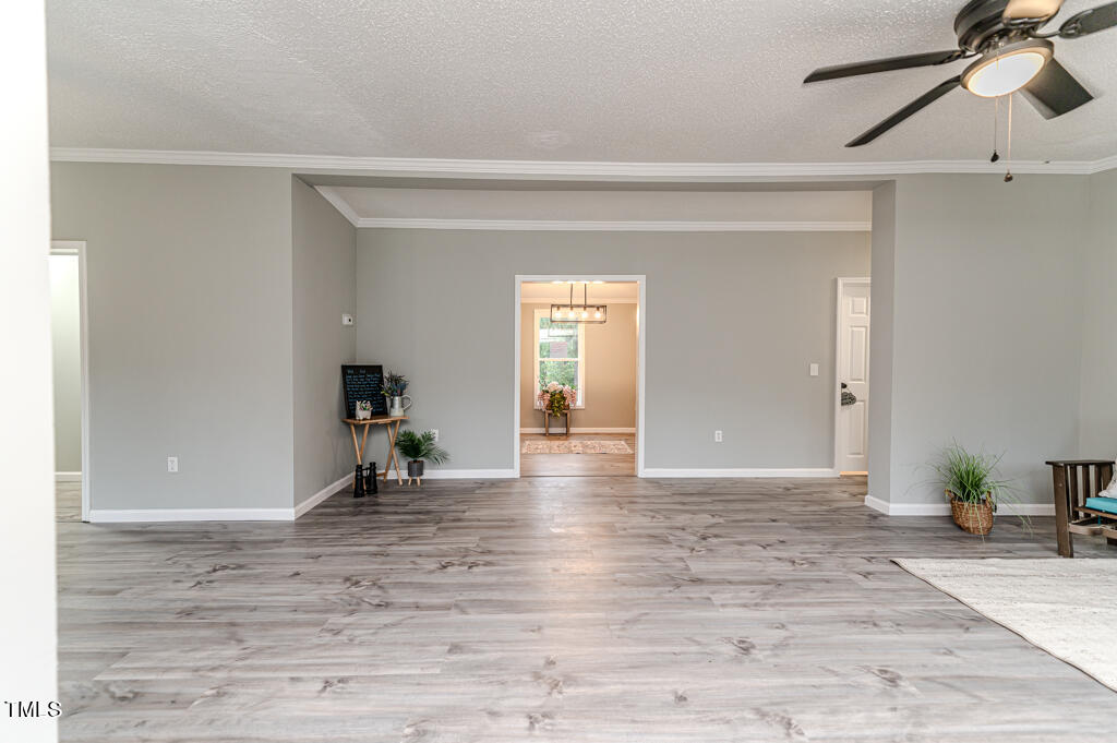 2245 Docs Road Lillington, NC 27546 - Photo 9 of 54 a view of a livingroom with wooden floor and furniture