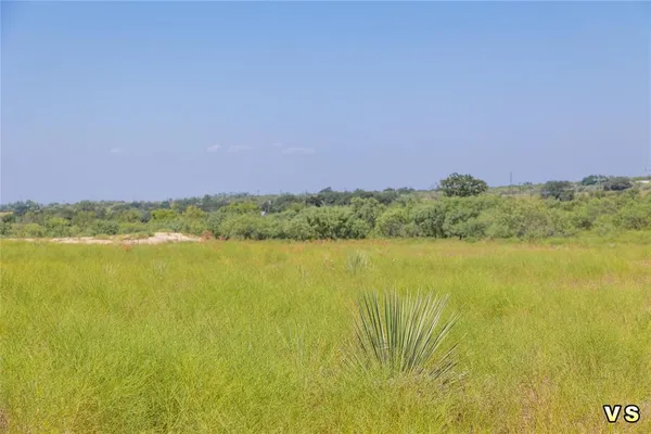 a view of a lake with a building in the background
