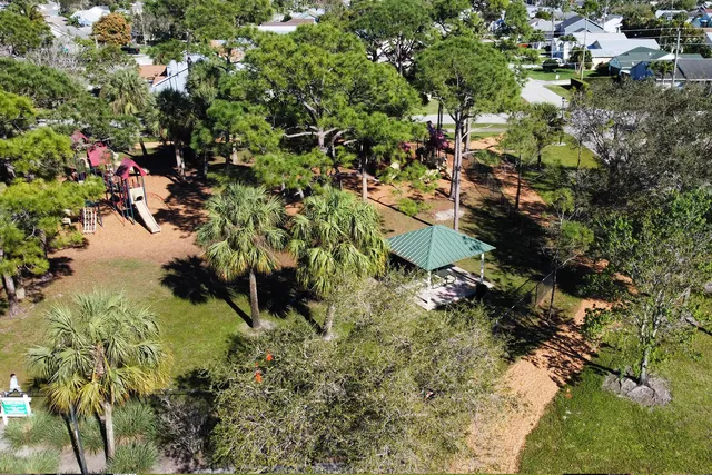 a swimming pool with an outdoor space and seating