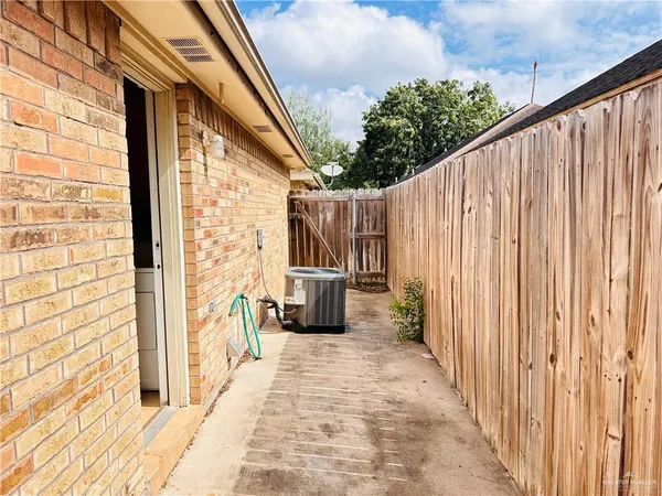 a view of a balcony with wooden floor and outdoor space