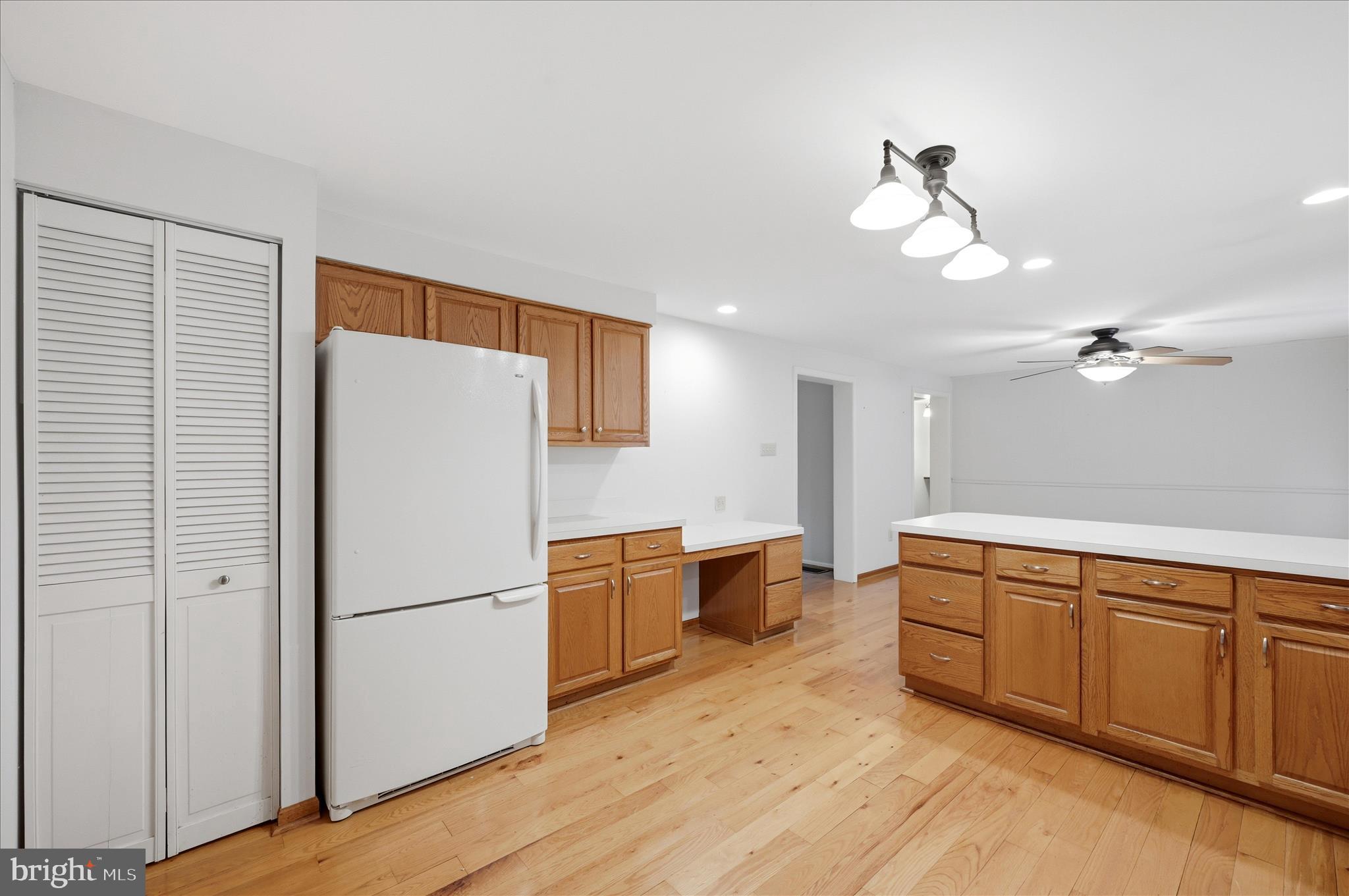 244 High Banks Road Stephenson, VA 22656 - Photo 17 of 45 a kitchen with stainless steel appliances granite countertop a refrigerator a sink dishwasher a oven with white cabinets and wooden floor